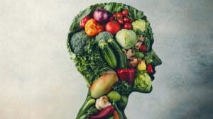 Warzywa ułożone w kształt ludzkiej głowy symbolizują naturalne wsparcie dla pamięci i koncentracji.