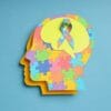Grafika przedstawia profil głowy z kolorowych puzzli, symbolizująca prewencję w chorobach neurologicznych.